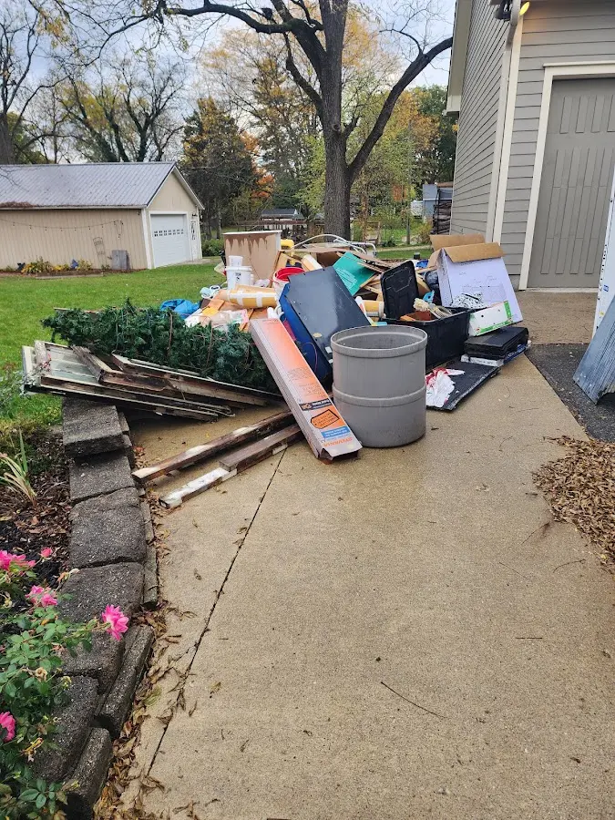 Dumpster being loaded with debris for Commercial Dumpster Rental in Guntersville